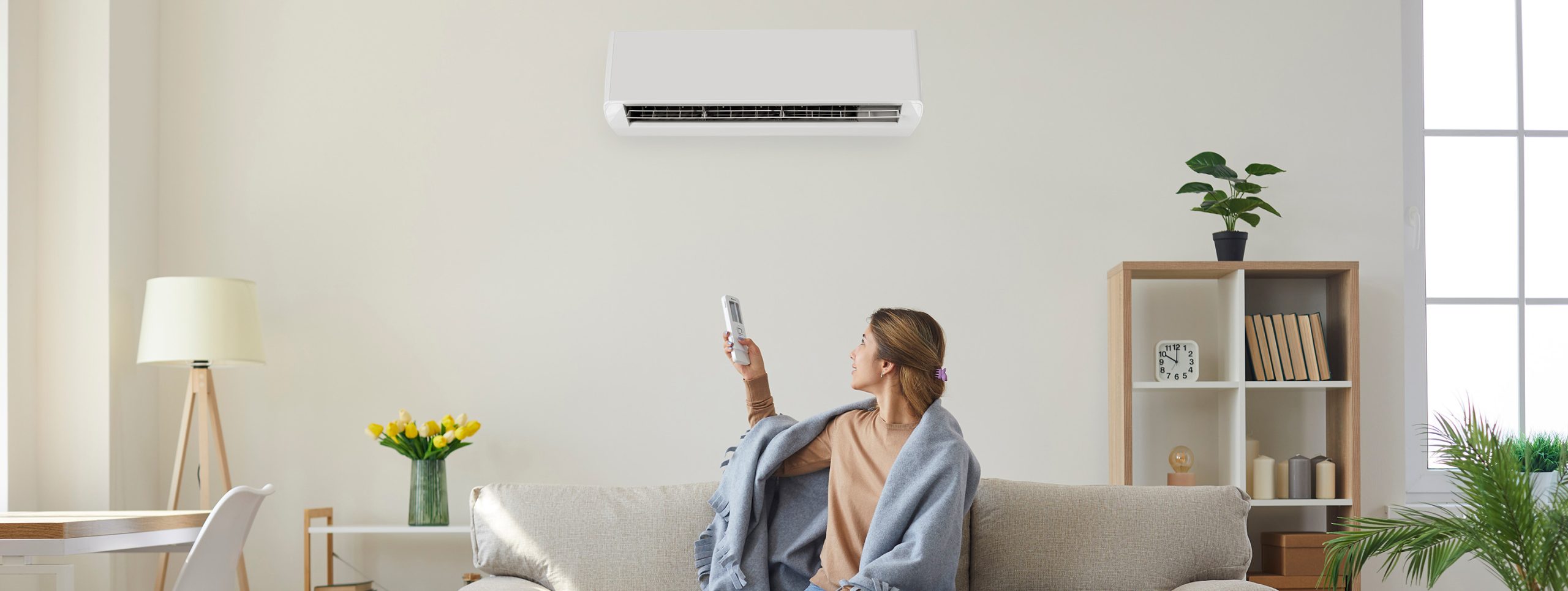 Woman using air source heat pump