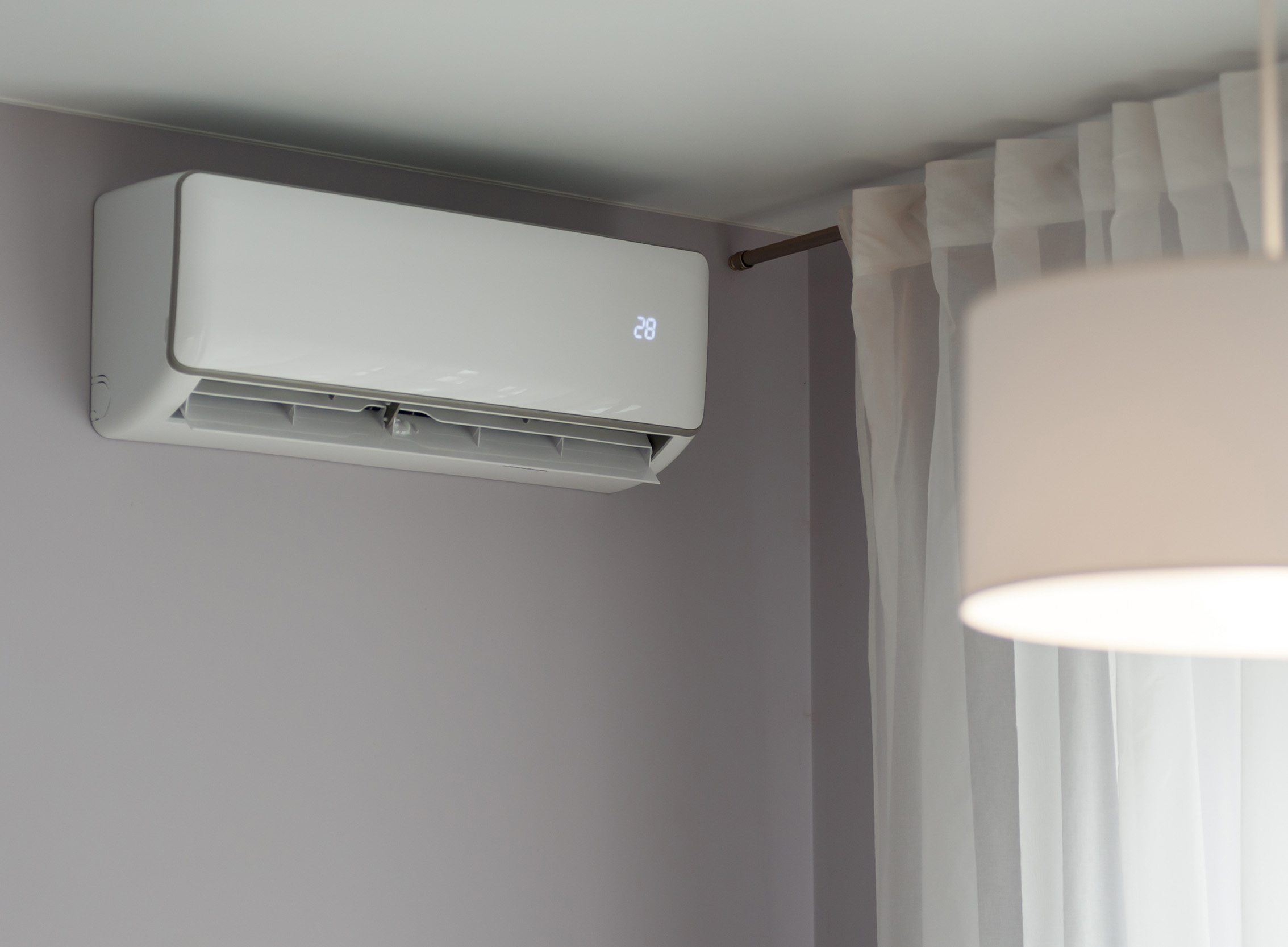 White ductless heat pump on wall