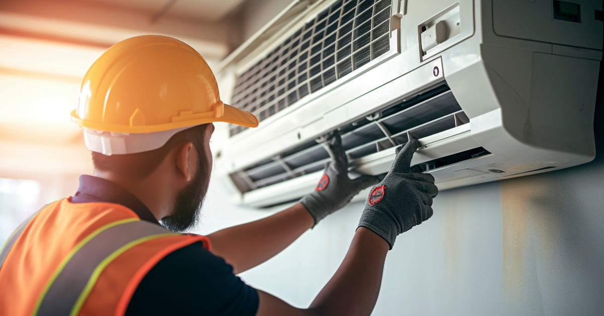 Technician servicing heat pump unit